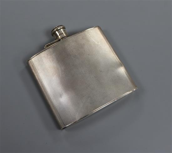 A George VI engine turned silver hip flask, A. Wilcox, Birmingham, 1939, 11cm.